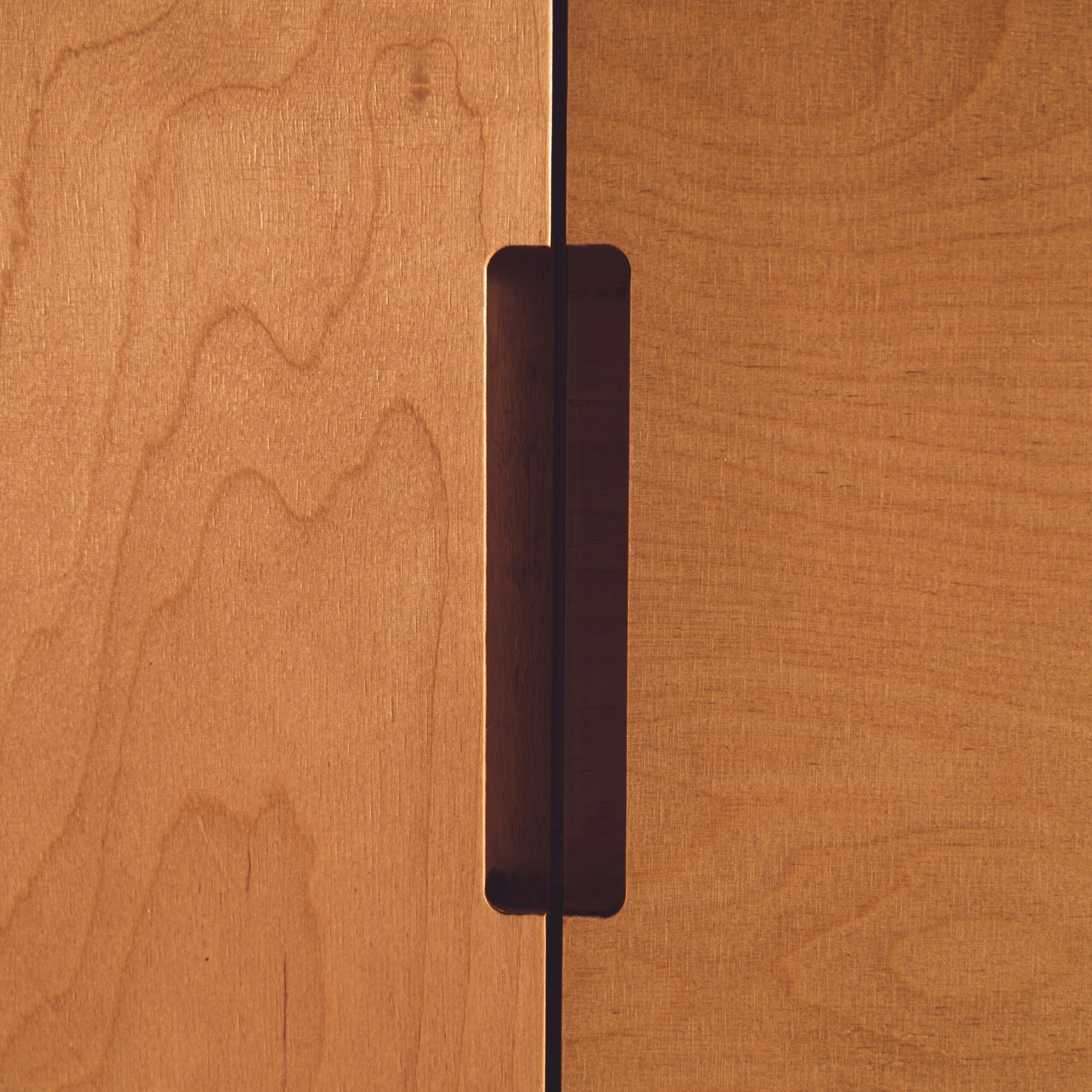alternative view cabinet cupboards in clients home as a final product, with custom routed handles.