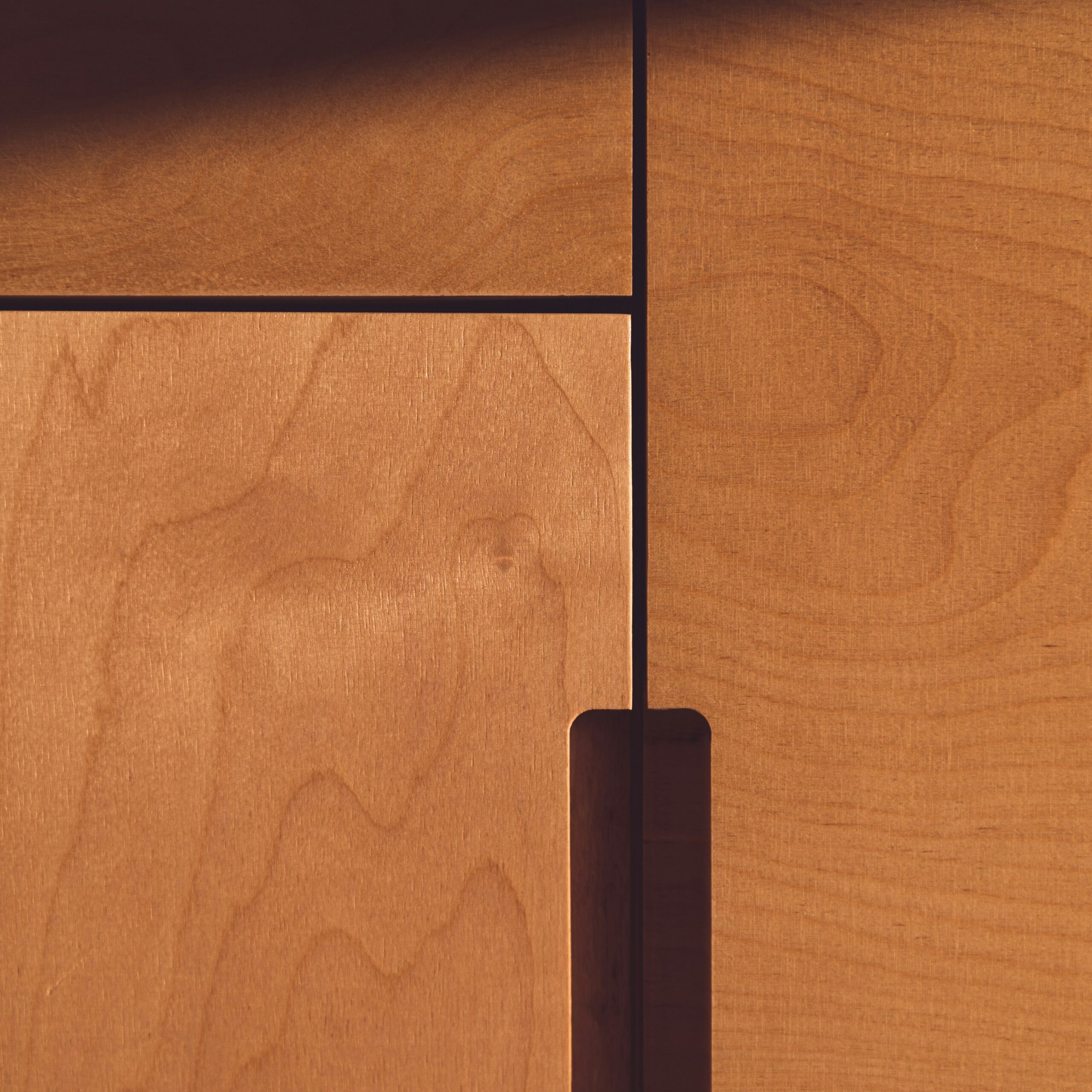 Cabinet cupboards in clients home as a final product, with custom routed handles.